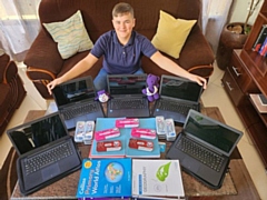 Milton with the laptops and teaching resources