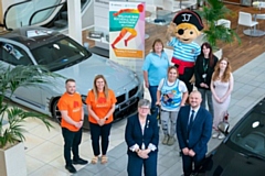 Left to right: Tom Hall and Laura Tomlinson from Maggie’s; Sarah Ford and Jaime Foster, Jolly Josh, the Jolly Josh mascot; Vicki Barnett, Jenna Kavanagh from Springhill Hospice with Councillor Janet Emsley, cabinet member for equity, safety and reform with Scott Cunningham, head of business at Williams Rochdale BMW