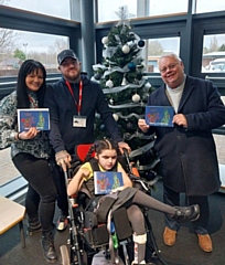 Council leader Neil Emmott with eight-year-old Erin Merrick, her mum and dad Emma and Ryan at Newlands School