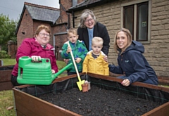 People of all ages are helping with the community garden.