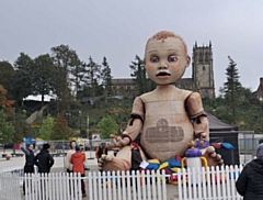 An 8.5 metre puppet of a giant baby called Lilly arrived for a ‘dress rehearsal’ in the town square 