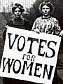 Emily Pankhurst with Votes for Women poster