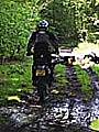 Off-road biker using rutted green lane