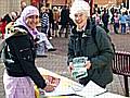 Pat Sanchez of High Peak, Littleborough explaining to a young supporter why she thinks people should sign the petition against Trident replacement.