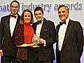 ITN News anchorman John Suchet presenting the Zen Web Solutions team the Award for Innovation.