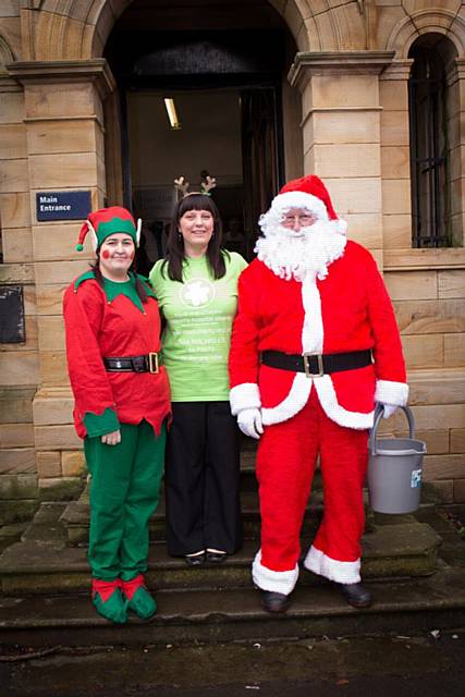 Janine Rez with Santa and his Elf