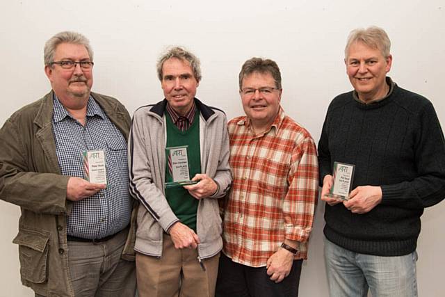 Richard Cafiero presents photography competition winners Peter Hook, David Woodhead (accepting for Ellen Kershaw) and Phil Seed, with their trophies.